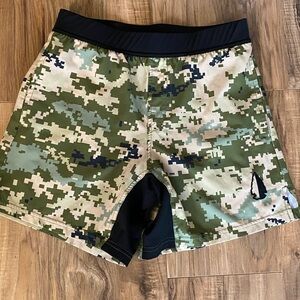 Tachuntfish Men’s Tachuntfish THF athletic shorts in digital camouflage print.